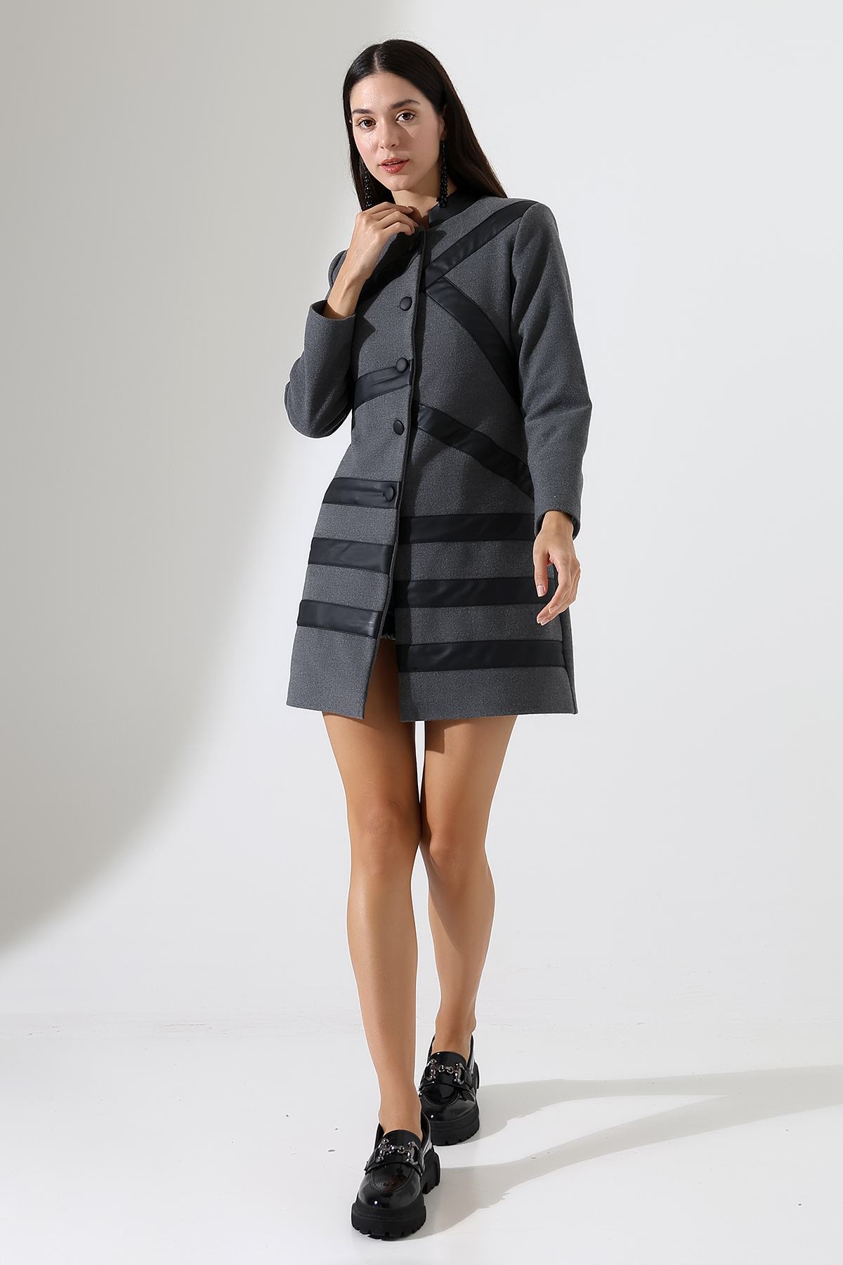 Model in Bespoke tailored grey cashmere coat with black leather stripes, luxury design inspired by French châteaux, Château Noir from Lavender Hands